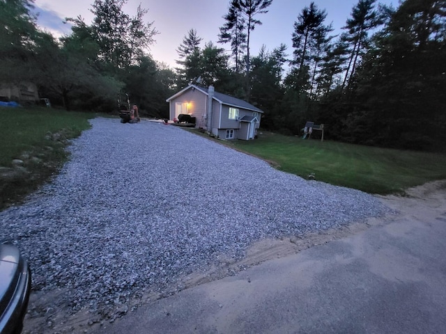 6 Alder Rd, Naples, ME 04055 - view of front of property with a chimney, a front lawn, and view of wooded area