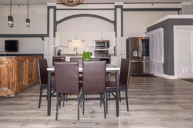 dining space featuring wood finished floors