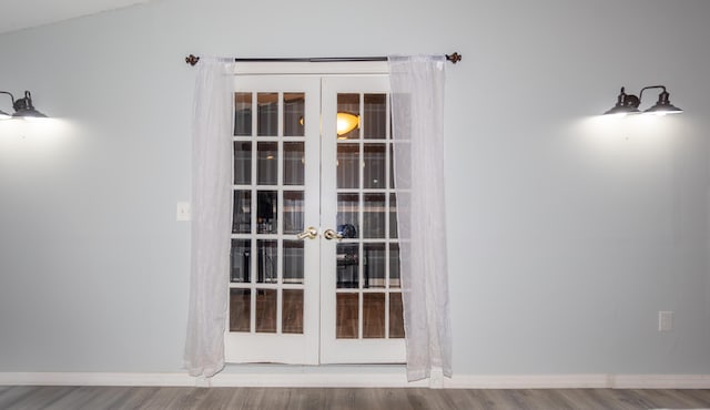 room details with wood finished floors, baseboards, and french doors