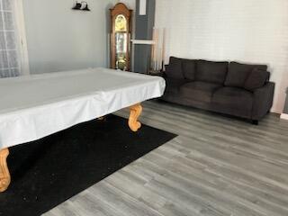 playroom featuring wood finished floors and pool table