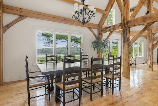 185 Bowmans Landing Rd, Georgetown, ME 04548 - dining room with beam ceiling, a chandelier, light wood-style flooring, and high vaulted ceiling
