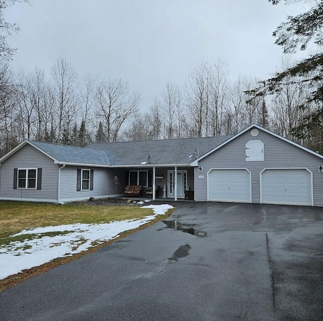 277 Grant Rd, Saint Albans, ME 04971 - ranch-style house featuring a front yard, an attached garage, covered porch, and aphalt driveway