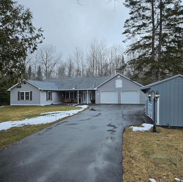 277 Grant Rd, Saint Albans, ME 04971 - ranch-style house featuring covered porch, an outdoor structure, a front lawn, an attached garage, and driveway