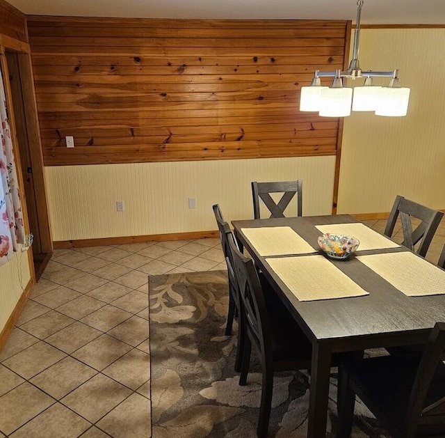 277 Grant Rd, Saint Albans, ME 04971 - dining room with light tile patterned floors, baseboards, and wooden walls