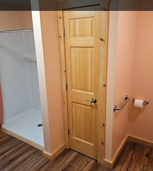 277 Grant Rd, Saint Albans, ME 04971 - interior space featuring a stall shower, wood finished floors, and baseboards