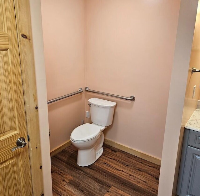 277 Grant Rd, Saint Albans, ME 04971 - half bath with vanity, baseboards, toilet, and wood finished floors