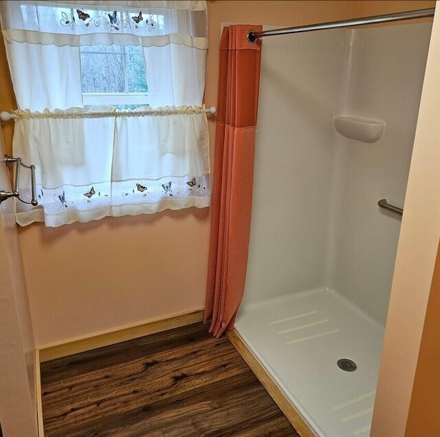 277 Grant Rd, Saint Albans, ME 04971 - bathroom featuring a stall shower and wood finished floors