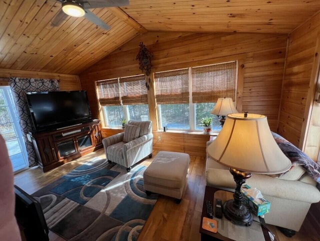 277 Grant Rd, Saint Albans, ME 04971 - living room featuring lofted ceiling, wood walls, ceiling fan, wood-type flooring, and wood ceiling