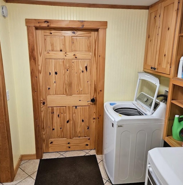 277 Grant Rd, Saint Albans, ME 04971 - laundry area featuring light tile patterned floors, baseboards, cabinet space, and washing machine and dryer