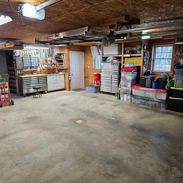 277 Grant Rd, Saint Albans, ME 04971 - garage featuring a garage door opener and a workshop area