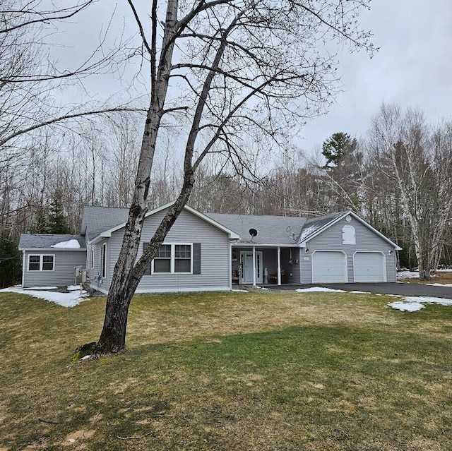 277 Grant Rd, Saint Albans, ME 04971 - ranch-style home featuring a front yard, covered porch, a garage, and aphalt driveway