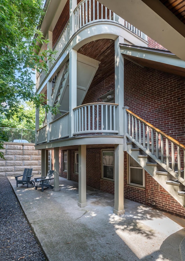 68 Pleasant St, Portland, ME 04101 - exterior space with a balcony, brick siding, and a patio area