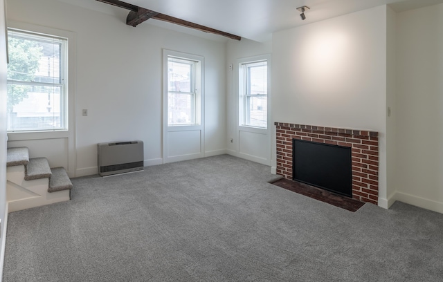 68 Pleasant St, Portland, ME 04101 - unfurnished living room with heating unit, carpet, beamed ceiling, and baseboards
