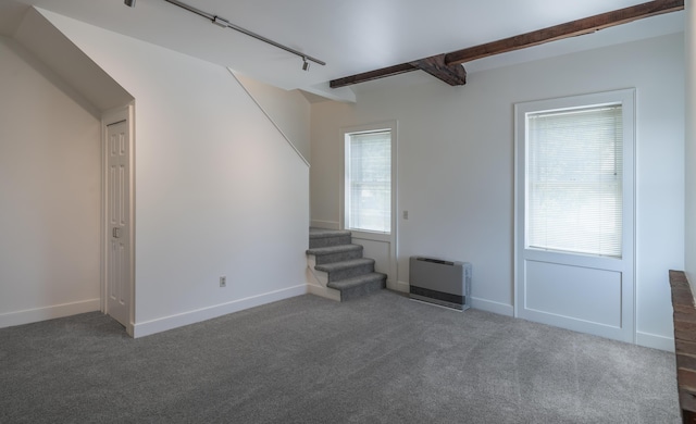 68 Pleasant St, Portland, ME 04101 - unfurnished living room featuring heating unit, stairs, rail lighting, and carpet