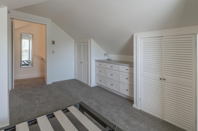 68 Pleasant St, Portland, ME 04101 - unfurnished bedroom featuring baseboards, carpet flooring, and vaulted ceiling