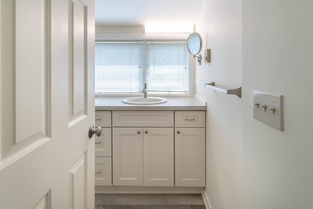 68 Pleasant St, Portland, ME 04101 - bathroom with vanity and baseboards