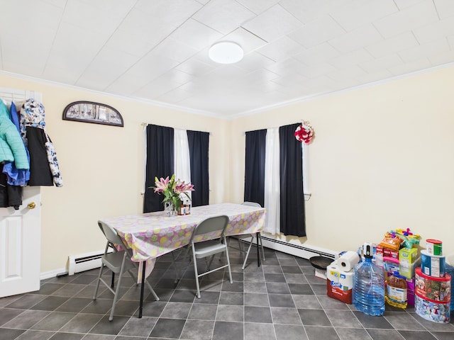 45 Crosby Ave, Caribou, ME 04736 - dining area with dark tile patterned floors, baseboard heating, and crown molding