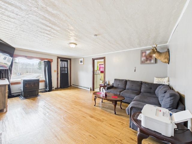 45 Crosby Ave, Caribou, ME 04736 - living room with a textured ceiling, a baseboard heating unit, and light wood finished floors
