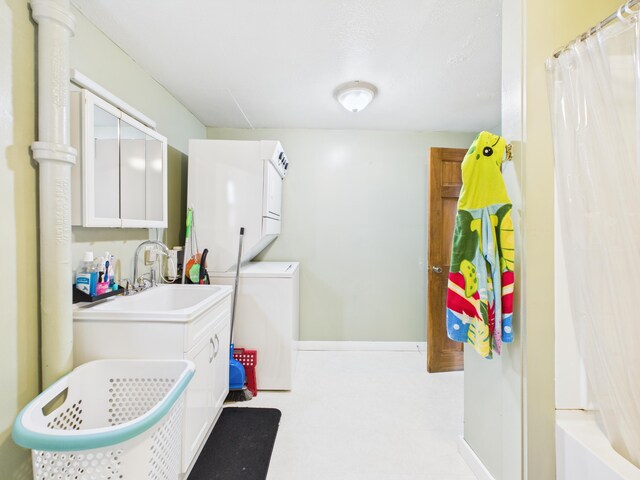 45 Crosby Ave, Caribou, ME 04736 - clothes washing area featuring stacked washer / drying machine, laundry area, and a sink