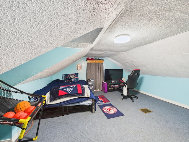 45 Crosby Ave, Caribou, ME 04736 - additional living space with a textured ceiling, visible vents, lofted ceiling, and carpet