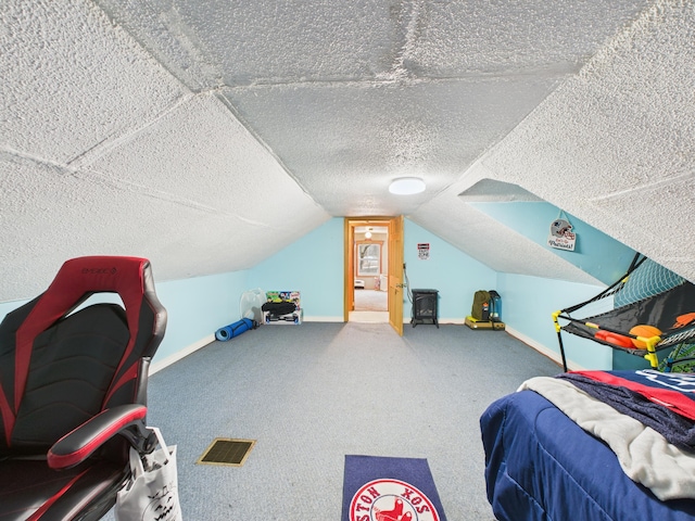 45 Crosby Ave, Caribou, ME 04736 - carpeted bedroom with baseboards, visible vents, a textured ceiling, and vaulted ceiling