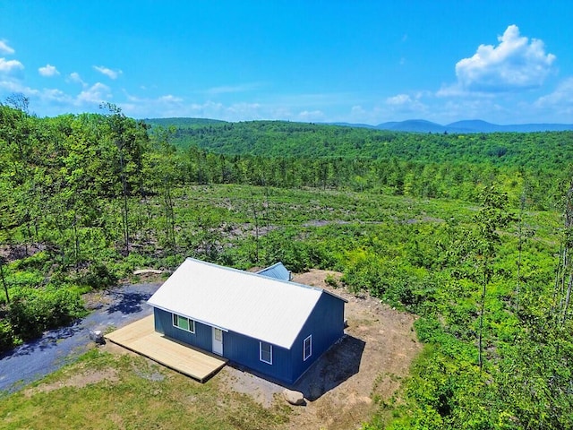 55 Emery Rd, Starks, ME 04911 - aerial view of property and surrounding area featuring a heavily wooded area