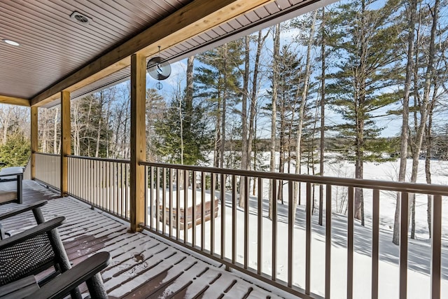 view of snow covered deck
