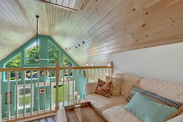 sitting room with wood ceiling, plenty of natural light, and lofted ceiling