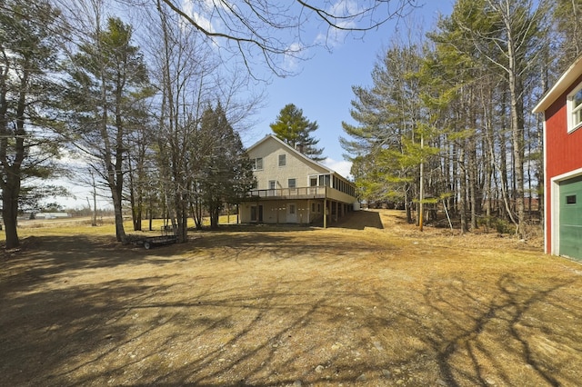 view of yard with a wooden deck