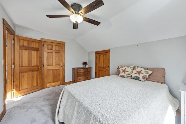 bedroom with carpet, ceiling fan, and lofted ceiling