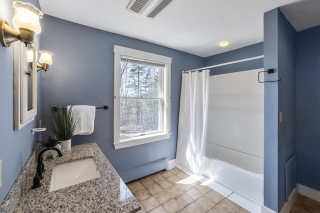full bath featuring visible vents, shower / tub combo with curtain, baseboards, and baseboard heating