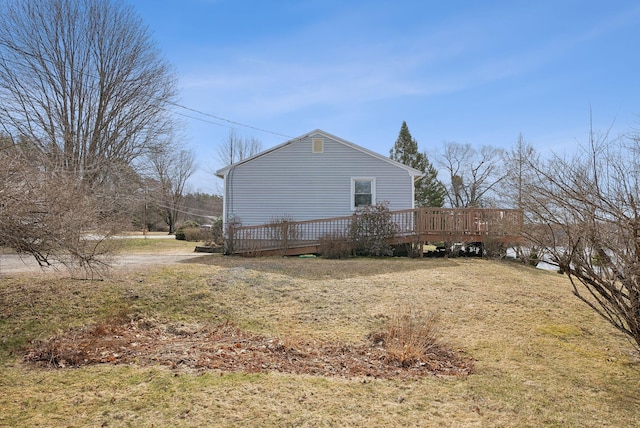 view of side of home with a deck