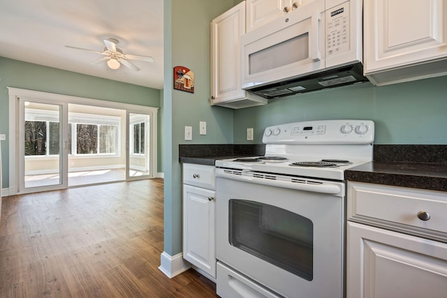 1 Old County Rd Unit 140, Wells, ME 04090 - kitchen featuring white appliances, dark countertops, ceiling fan, and dark wood-style floors