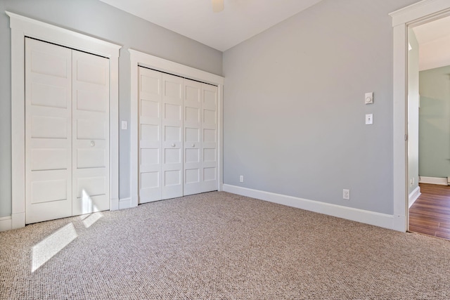 1 Old County Rd Unit 140, Wells, ME 04090 - unfurnished bedroom with baseboards, multiple closets, carpet floors, and a ceiling fan