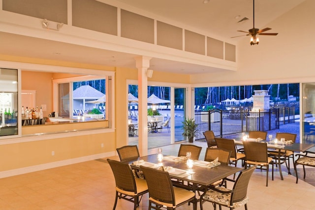 1 Old County Rd Unit 140, Wells, ME 04090 - dining space featuring a ceiling fan, a towering ceiling, and baseboards