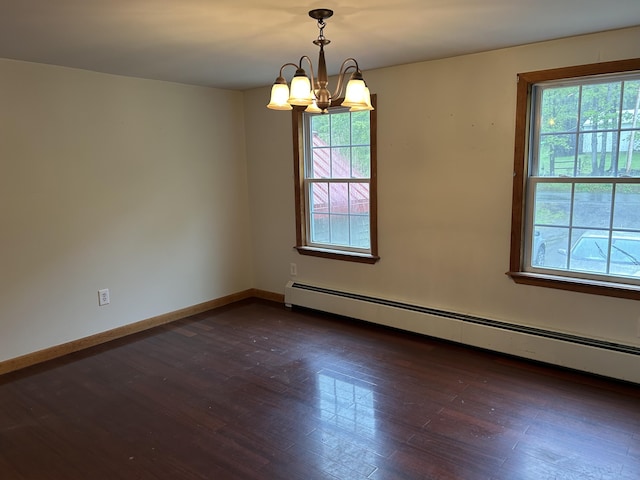 142 Abbott Rd, Albion, ME 04910 - unfurnished room with a baseboard heating unit, healthy amount of natural light, a chandelier, and dark wood finished floors