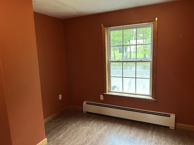 142 Abbott Rd, Albion, ME 04910 - spare room with a baseboard heating unit, wood finished floors, and baseboards