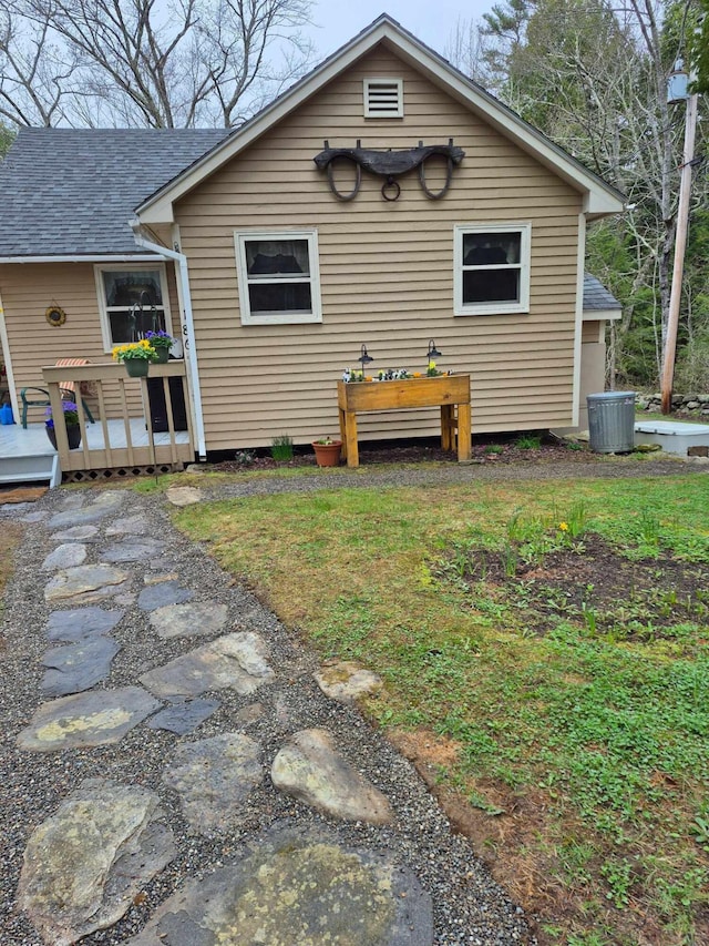 186 Hawes Ln, Union, ME 04862 - rear view of property featuring a wooden deck, a shingled roof, and central AC