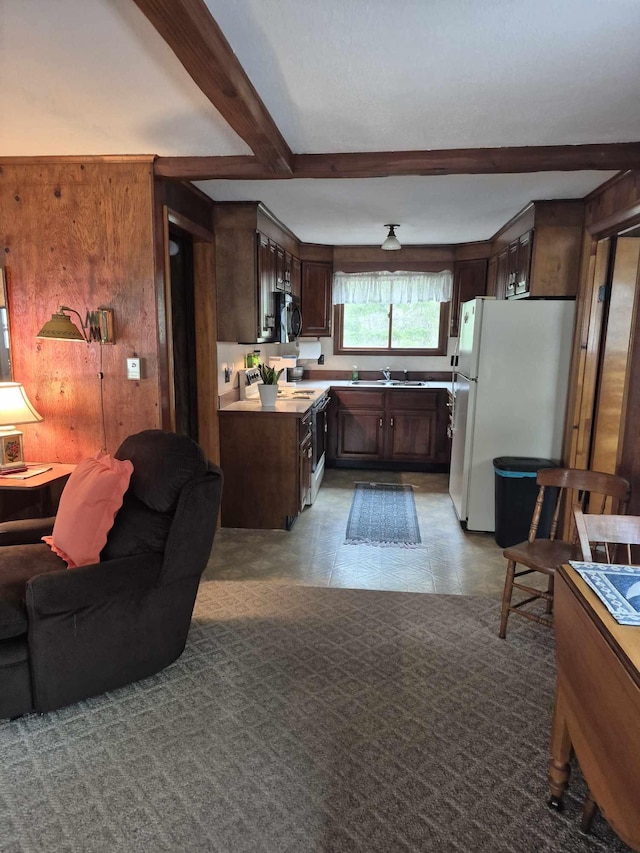 186 Hawes Ln, Union, ME 04862 - kitchen featuring freestanding refrigerator, beam ceiling, dark brown cabinetry, open floor plan, and electric stove