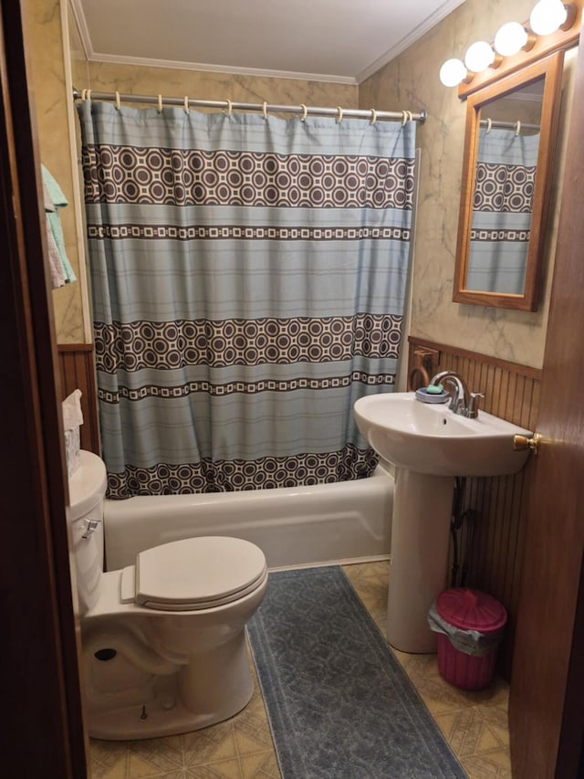 186 Hawes Ln, Union, ME 04862 - bathroom with toilet, shower / tub combo, ornamental molding, a wainscoted wall, and a sink