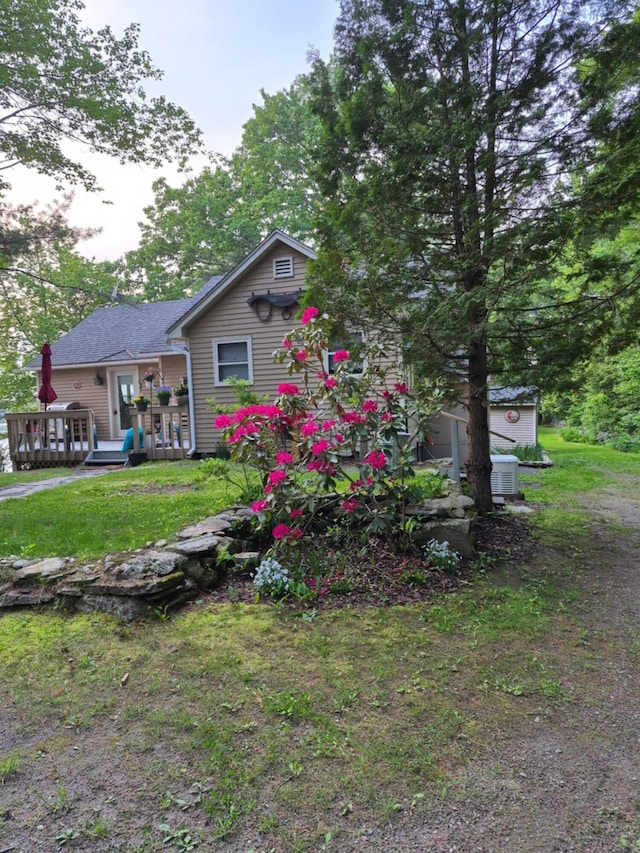 186 Hawes Ln, Union, ME 04862 - view of property exterior with a wooden deck and a lawn