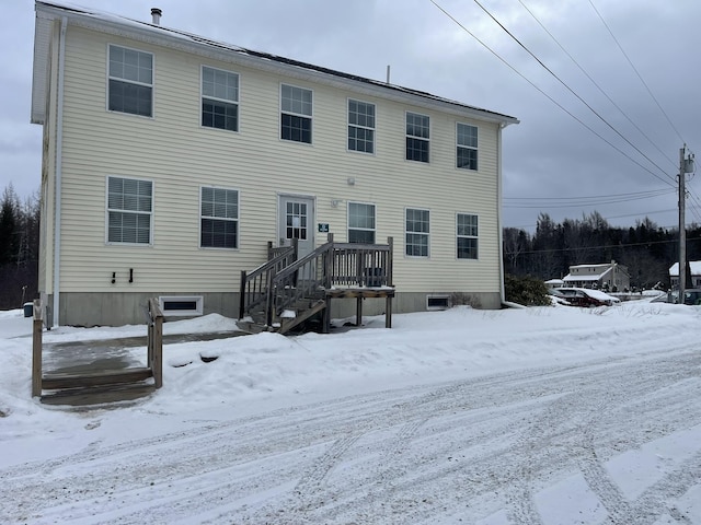 view of snow covered house