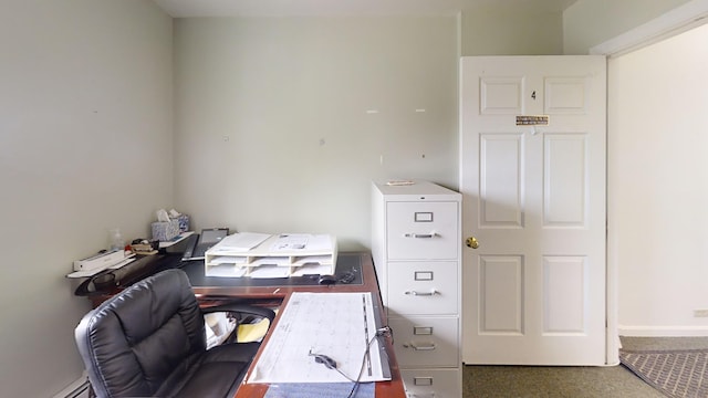 home office with a baseboard heating unit and baseboards