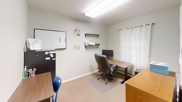 home office with baseboards and carpet