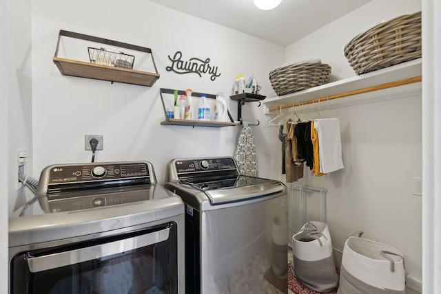 washroom featuring laundry area and washer and dryer
