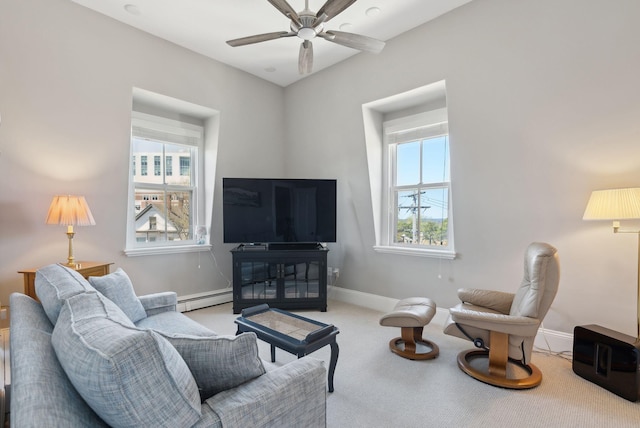 carpeted living room featuring baseboards, a baseboard radiator, and ceiling fan