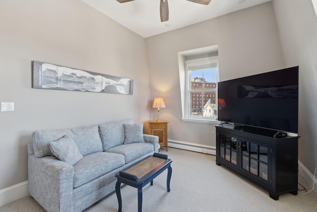 living room featuring baseboards, a baseboard radiator, carpet, and a ceiling fan