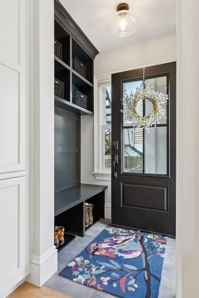 mudroom with a chandelier