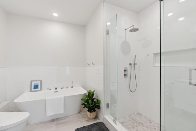 125 Morning St Unit 3/6, Portland, ME 04101 - full bath with a shower stall, recessed lighting, toilet, and a soaking tub
