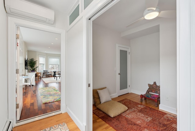 125 Morning St Unit 3/6, Portland, ME 04101 - entryway with baseboards, recessed lighting, wood finished floors, a baseboard heating unit, and a wall unit AC
